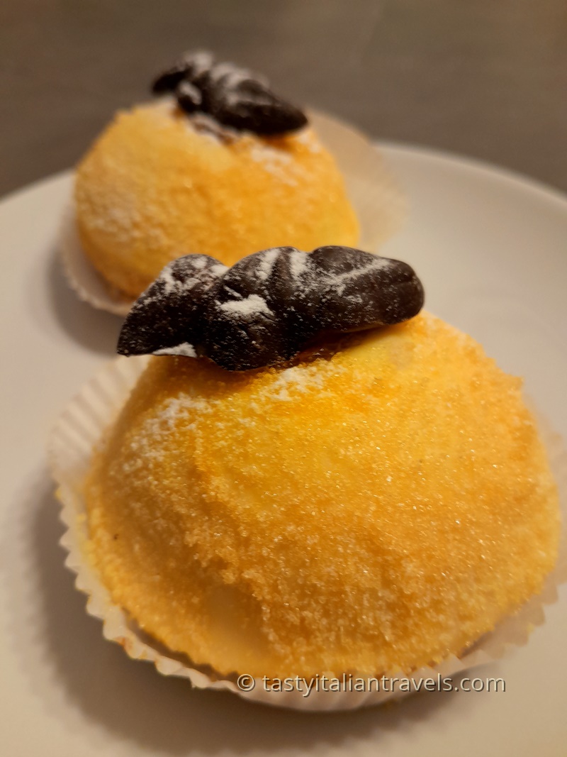 Polenta e osei cake, a traditional Bergamo dessert with yellow marzipan coating and chocolate bird decoration