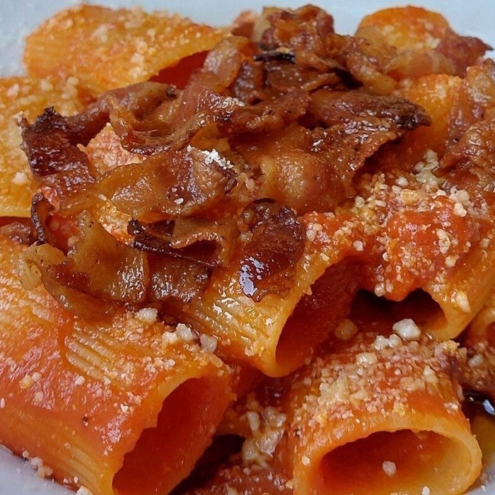 Youâll try Amatricianaârich tomato-based pasta with guancialeâon the Gourmetaly food tour in Rome Amatriciana, a rich tomato-based pasta with guanciale, served on the Gourmetaly food tour in Rome