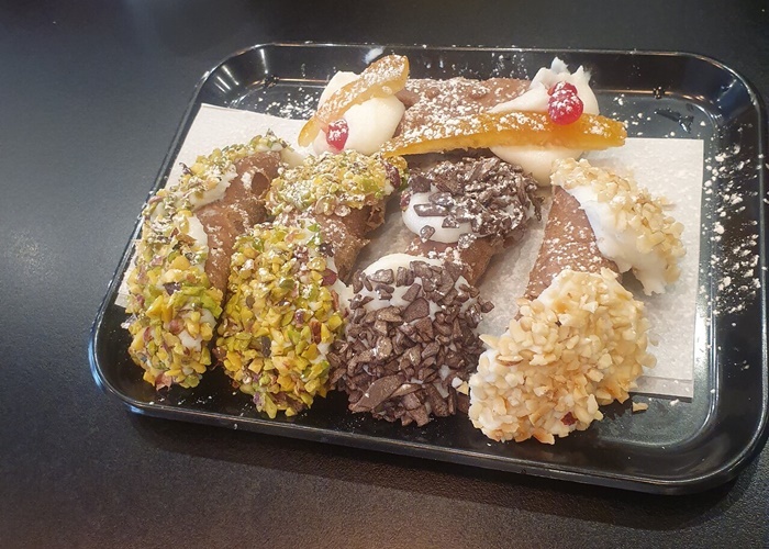 Sicilian cannoli in Pratiâperfectly crisp and filled with creamy goodness Authentic Sicilian cannoli filled with sweet ricotta cream, enjoyed during a Rome food tour in the Prati district