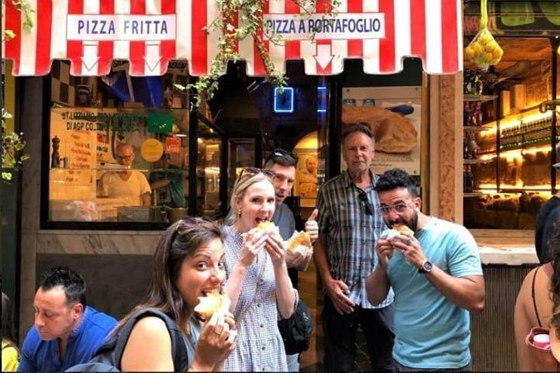 Happy Travellers Enjoying a Secret Food Tour in Naples Happy travellers enjoying local food tastings on a Secret Food Tour in Naples