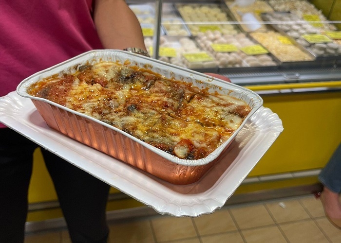 Eggplant parmigiana at Trionfale Marketâcomfort food, Roman-style Classic eggplant parmigiana served warm at Romeâs Trionfale Market during a food tourâlayered with cheese, tomato sauce, and fresh eggplant