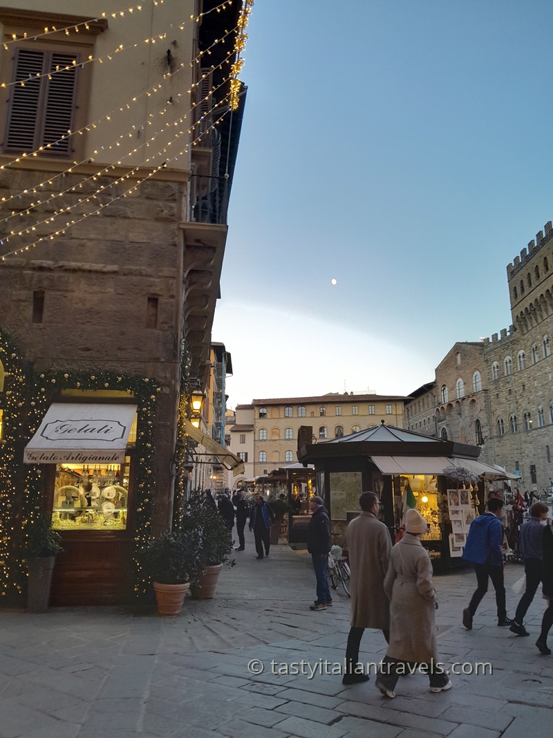 Festive early December street in Florence with Christmas lights and a calm atmosphere
