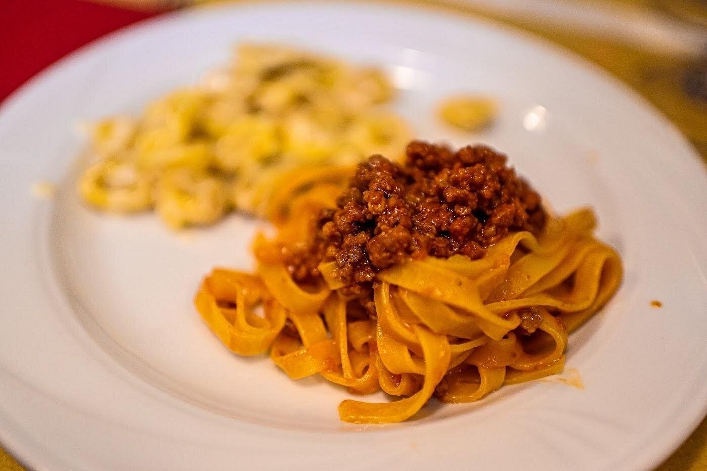 Authentic Bologna Food Tour Experience with Tagliatelle al Ragù and Tortellini A delicious plate of tagliatelle al ragù and handmade tortellini enjoyed during our guided Bologna food tour