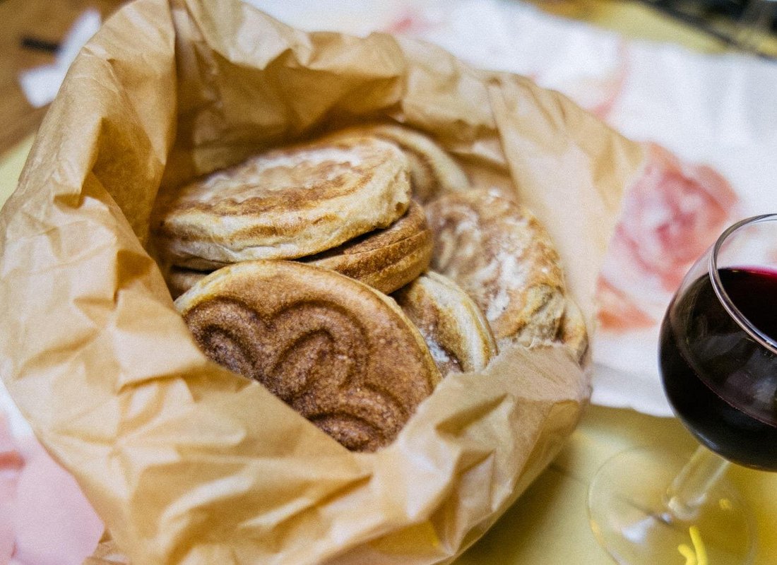 Delicious tigelle, a classic Bolognese bread Traditional tigelle bread served with cold cuts and cheeses from Bologna