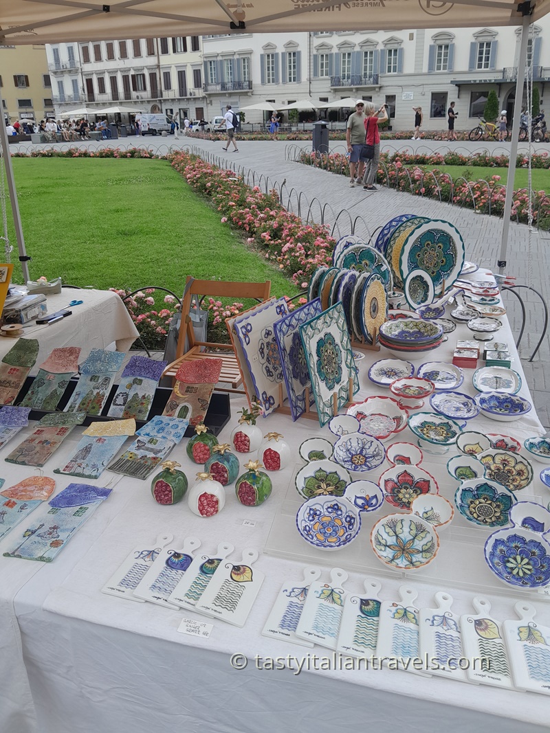 Colourful souvenir stalls in Piazza di Santa Maria Novella selling affordable gifts and trinkets