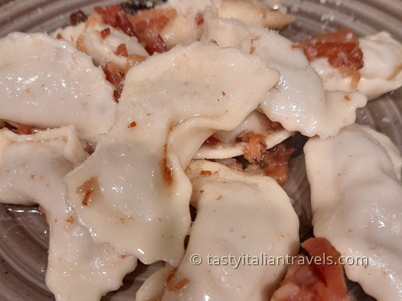 Casoncelli alla bergamasca, traditional stuffed pasta from Bergamo served with butter, sage, and pancetta