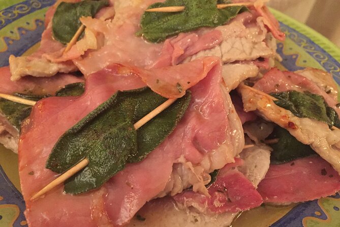 Saltimbocca alla Romana â Traditional Roman Dish Made in a Cooking Class Plated Saltimbocca alla Romana featuring tender veal, prosciutto, and fresh sage, prepared during a cooking class in Rome