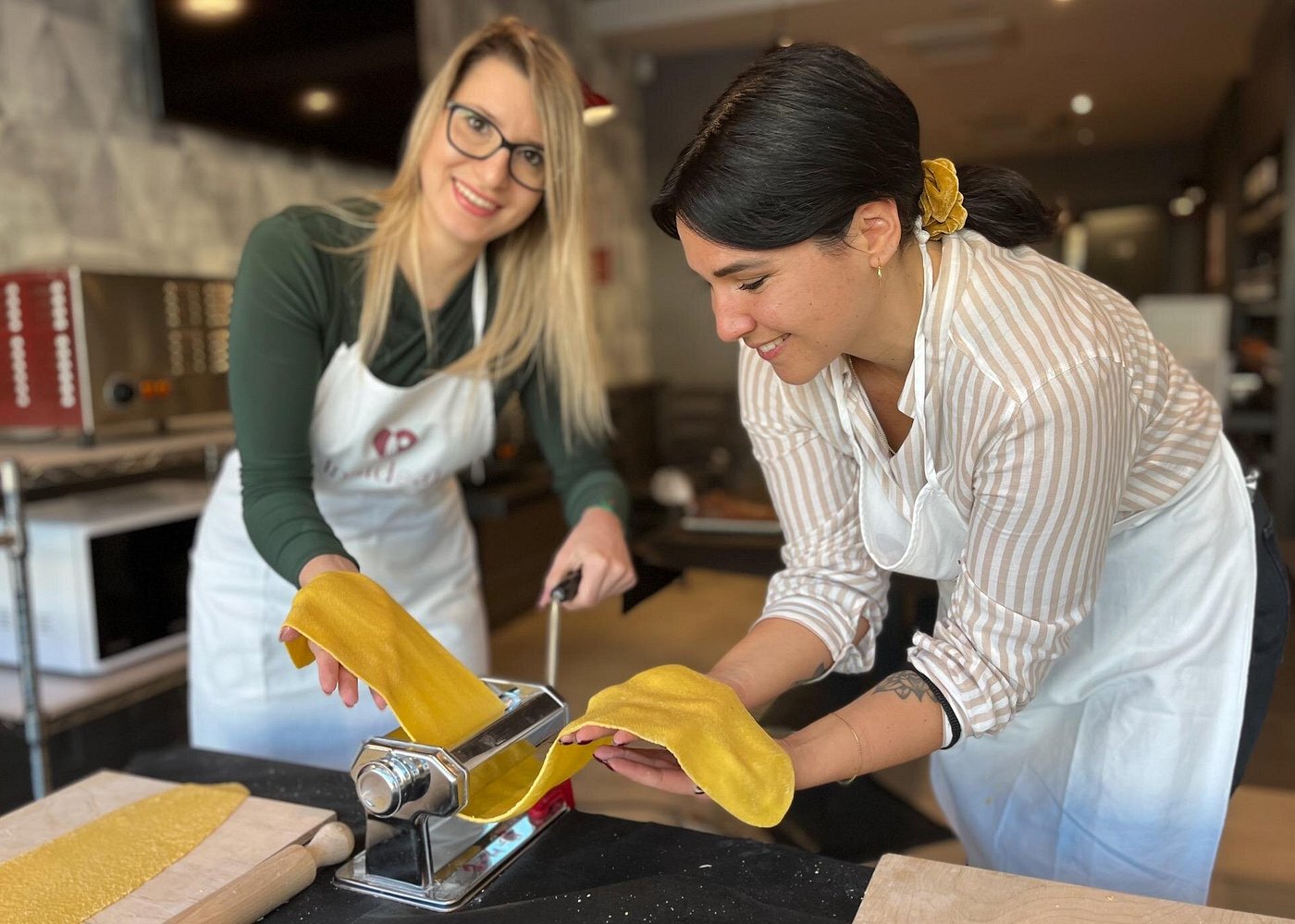 One-Hour Pasta Making Class in Rome â Quick Cooking Experience Near the Vatican Participants making fresh fettuccine during a 1-hour pasta class at a restaurant near the Vatican in Rome