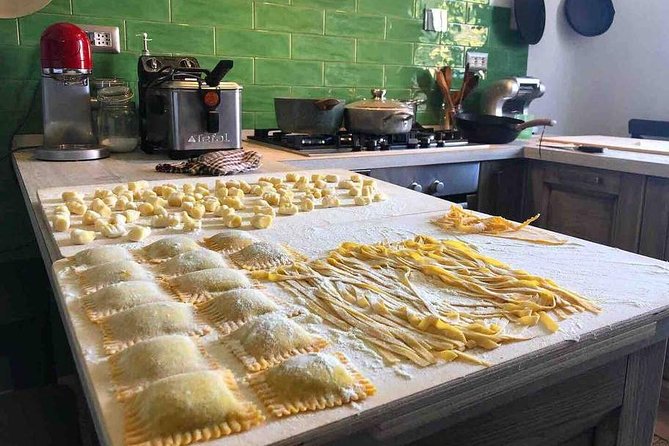 Freshly made tagliatelle, ravioli, and gnocchi on a kitchen counter during Chef Luca’s hands-on cooking class in Florence, Italy