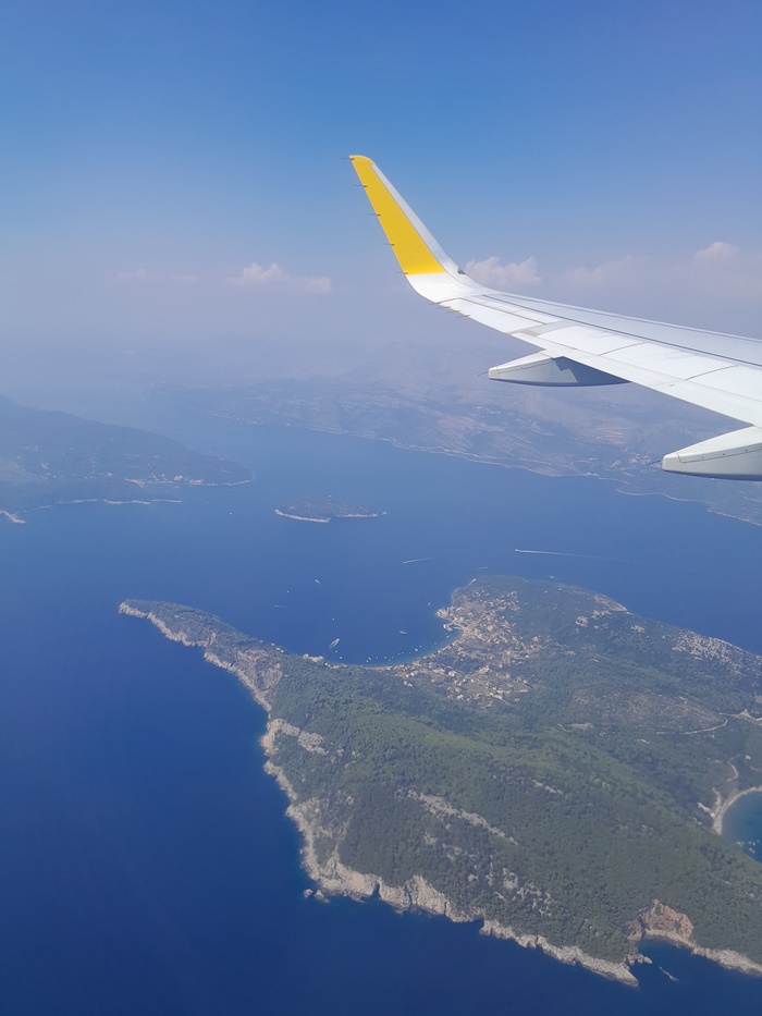 View from the plane window, watching the Elaphiti Islands pass below on the journey from Rome to Dubrovnik
