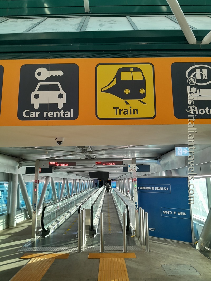 Yellow “Train” sign for the Leonardo Express at Fiumicino Airport