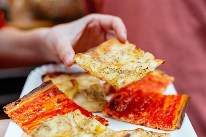 Hot from the ovenâclassic pizza Margherita on our Rome food adventure Freshly baked pizza Margherita enjoyed during a Rome food tourâthin crust, tomato sauce, and mozzarella