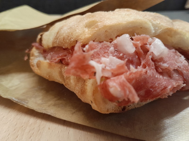 Schiacciata Sandwich – A Must-Try Street Food in Florence Schiacciata sandwich with Tuscan cured meats — a popular street food in Florence