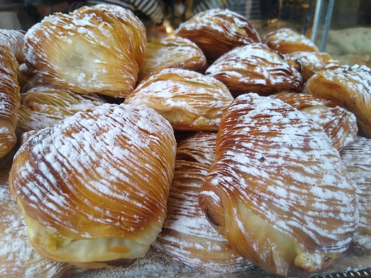Sfogliatelle Ricce – Classic Neapolitan Pastries with a Crispy, Layered Shell Golden, flaky sfogliatelle ricce pastries, a traditional Neapolitan dessert