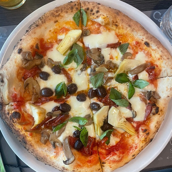 Homemade Pizza with Rich Toppings â Made in a Rome Cooking Class Freshly baked pizza with rich toppings, made during a hands-on pizza-making class in Rome