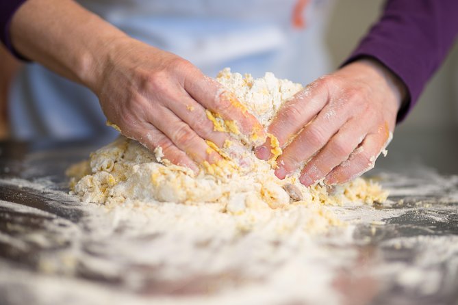 Kneading fresh pasta dough during a cooking class in Florence Kneading fresh pasta dough during a cooking class in Florence