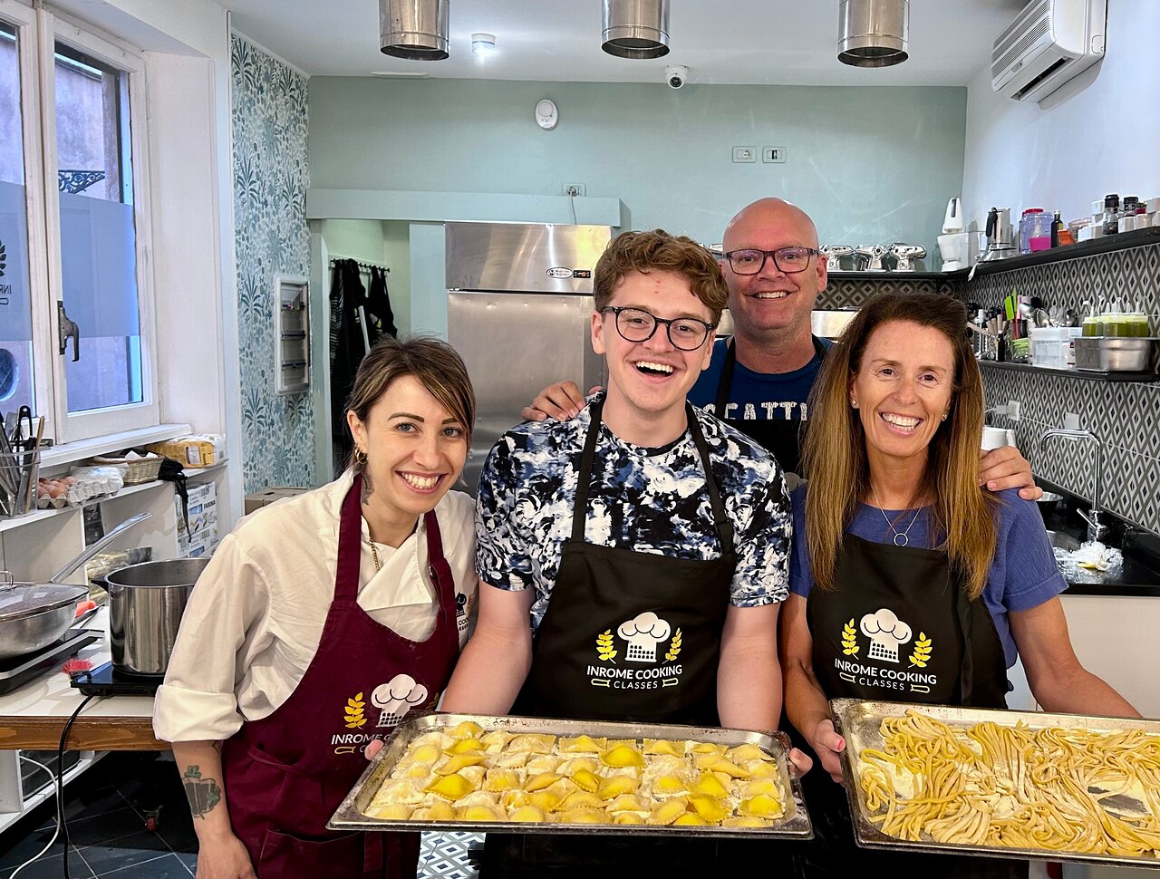 Making fresh pasta at In Rome Cooking – a top-rated class in the heart of Rome Guests holding freshly made pasta during a hands-on cooking class with In Rome Cooking near Piazza Navona