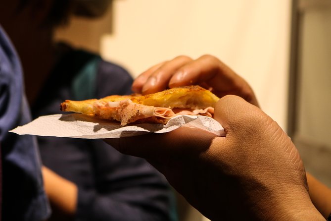 Unique pizza-style delicacies served on a food tour in Monti, Rome