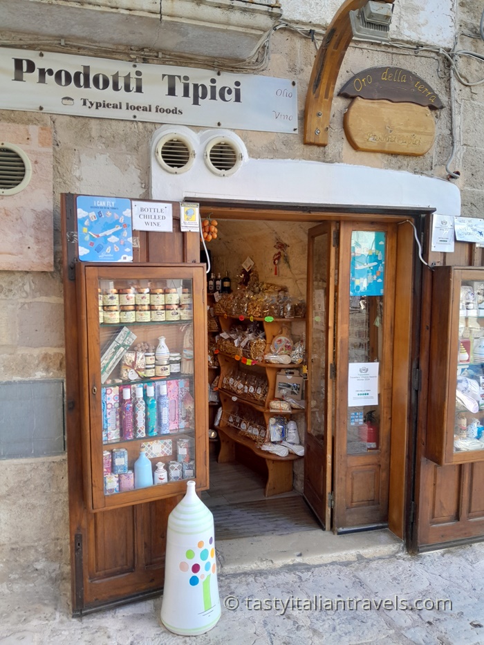 Oro della Terra shop in Polignano a Mare with shelves of typical Apulian food products