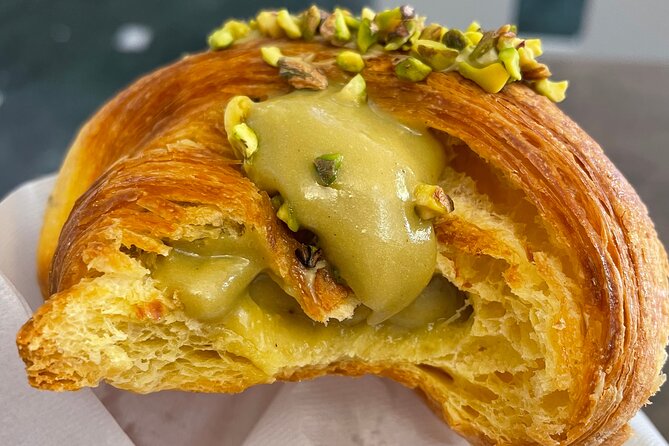A flaky pastry filled with rich pistachio cream—almost too beautiful to eat (but trust us, you will!). Just one of the irresistible treats you'll try on this Florence foodie tour!