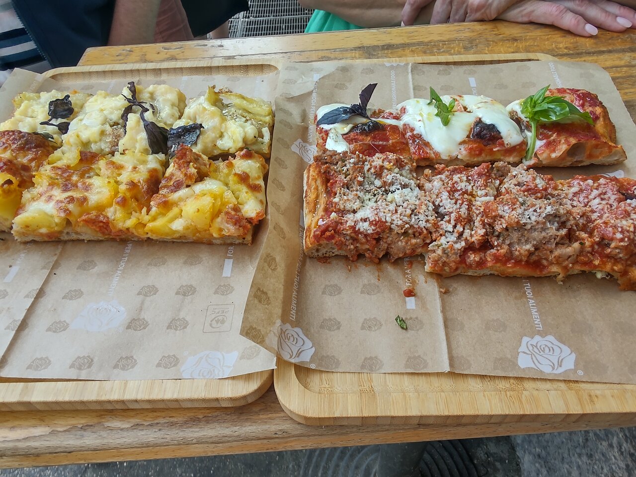 Rich and tasty pizza al taglio served during a Rome food tour in Prati
