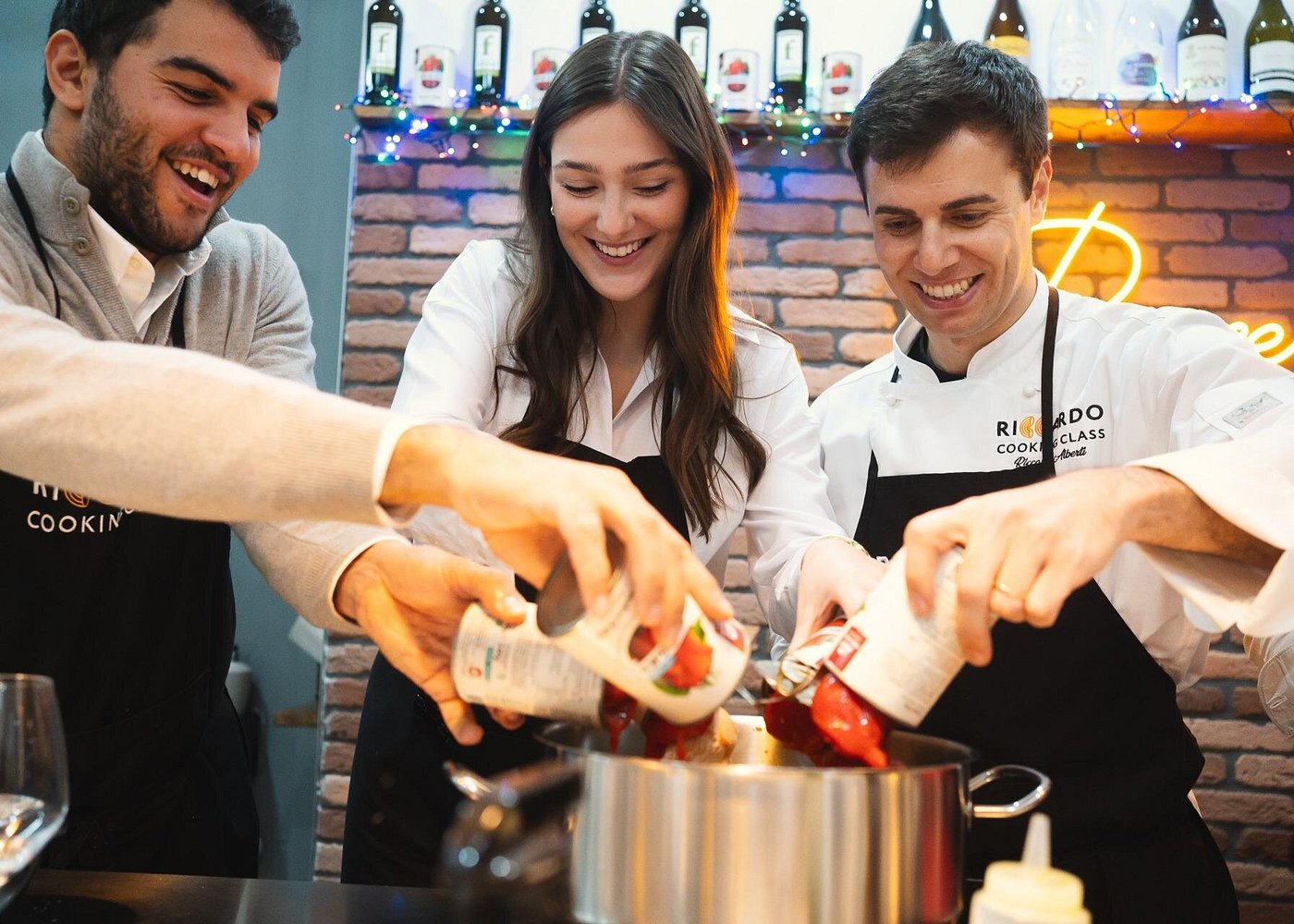 Cooking Italian sauces at the Rome Cooking Club pasta class in Rome Cooking Italian sauces at the Rome Cooking Club pasta class in Rome