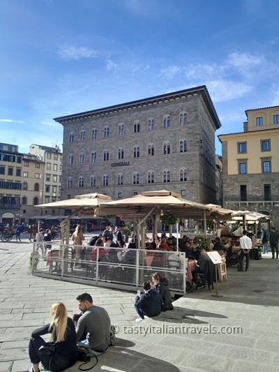 Tourists enjoying the lively Piazza della Signoria in Florence