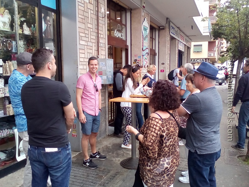 Our happy food tour group smiling and waiting for the next Roman food tasting