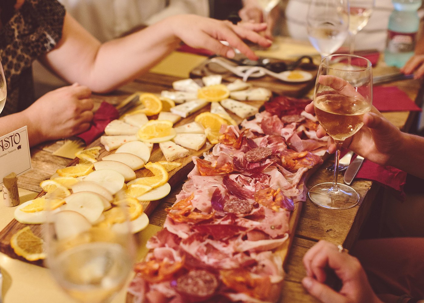 A platter of Italian cured meats and cheeses served during a Rome food tour, featuring prosciutto, salami, pecorino, and aged parmesan