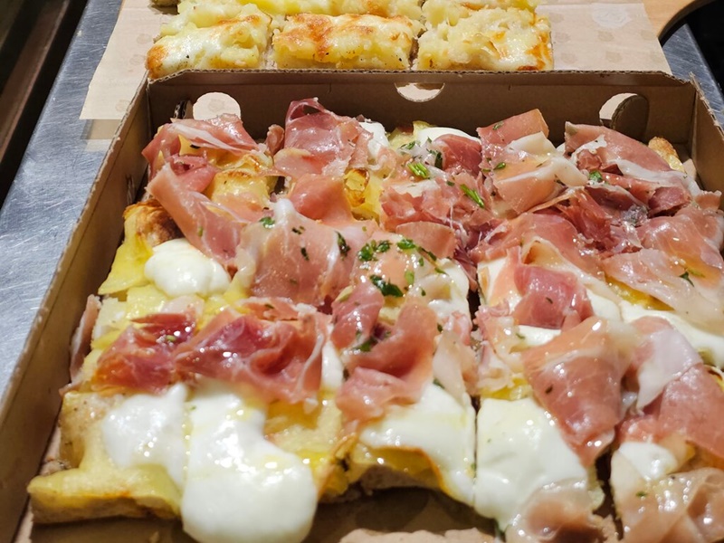 Super delicious pizza al taglio served during a Roman food tour in Prati