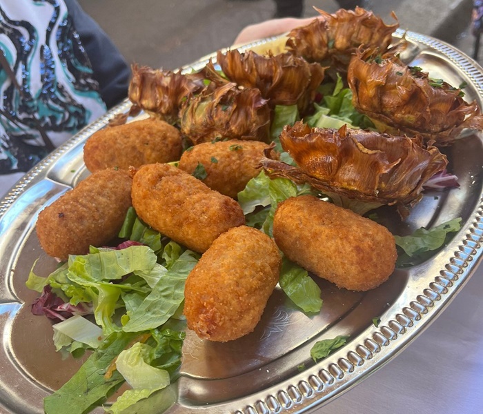 Supplì and crisp fried artichokes - fried delicacies you'll try on this Rome food tour by Gourmetaly!