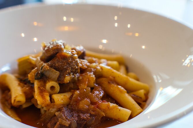 Ziti alla Genovese – Hearty Neapolitan Pasta with Rich Meat and Onion Sauce Close-up of ziti alla genovese, a traditional Neapolitan pasta with slow-cooked meat and onion sauce
