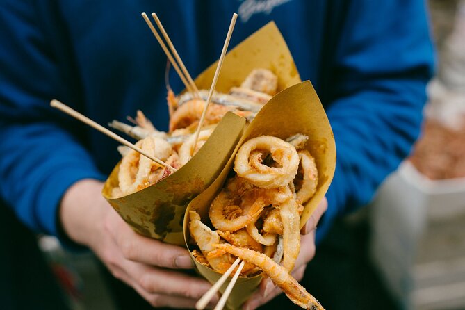'Cuoppo di pesce' - a paper cone filled with freshly fried seafood 'Cuoppo di pesce' - a paper cone filled with freshly fried seafood