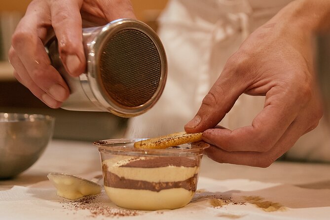 Making classic tiramisù during the Florence cooking and market class with Towns of Italy