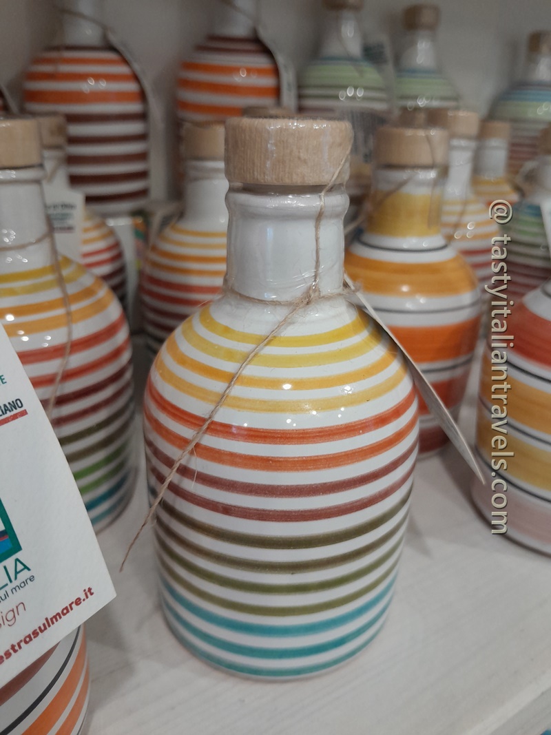 Ceramic orcio filled with Puglian olive oil, a traditional souvenir from Puglia