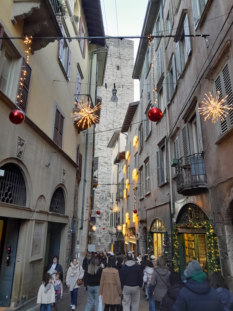 Strolling through the narrow, charming streets of Città Alta in Bergamo with historic buildings and cobblestone paths