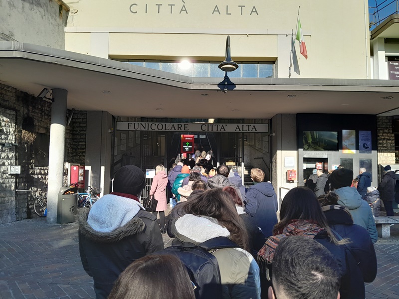 People waiting to board the funicular car in Bergamo